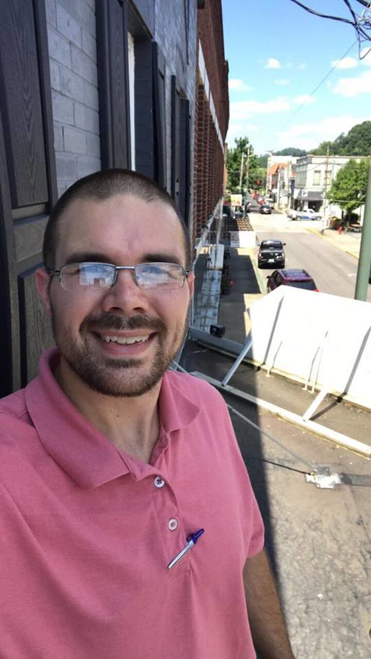 Josh Johnson stands atop the awning